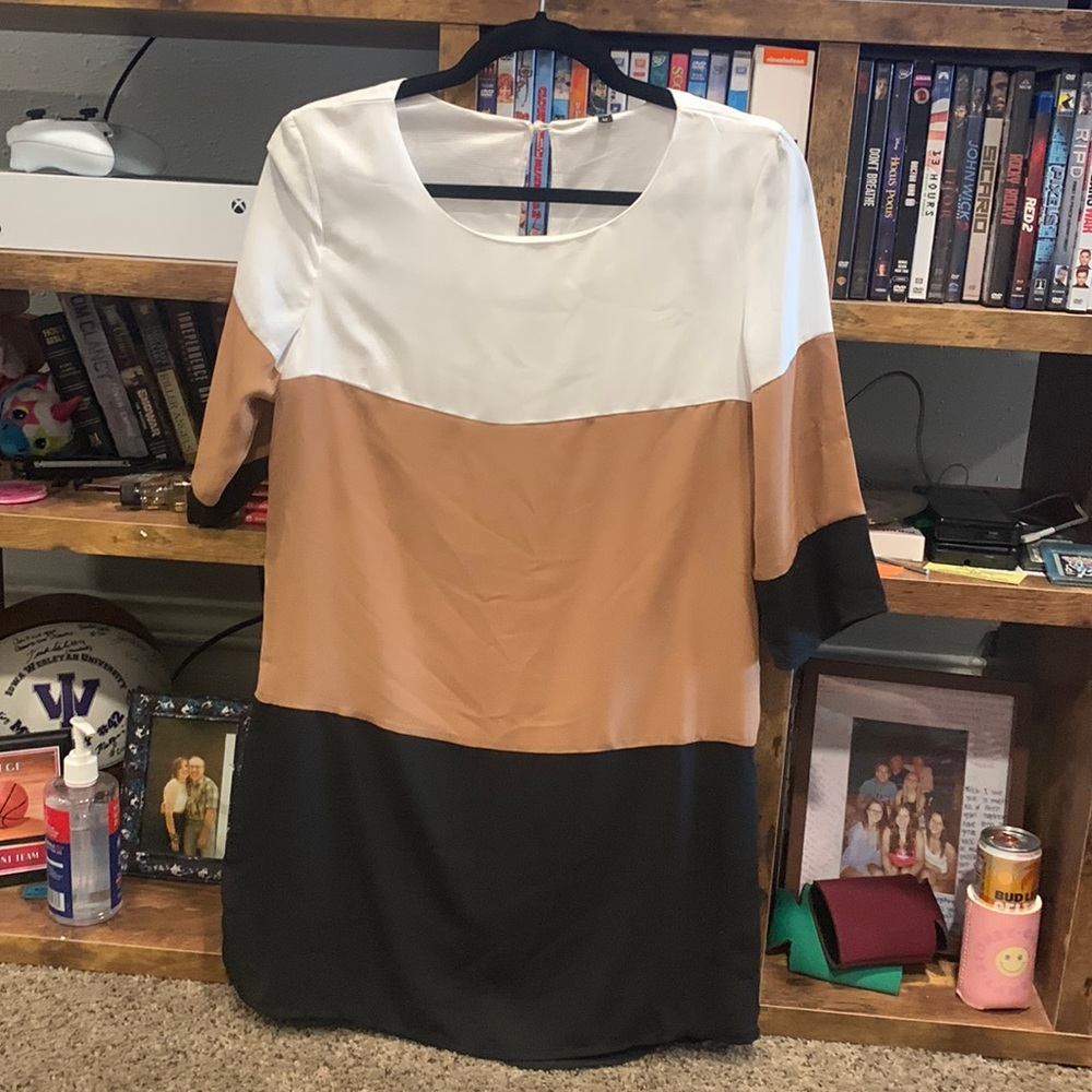 Discover the White coffee black colour block dress you never knew you needed.